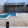 Reforma: Instalação de piscina e criação de área gourmet.