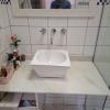 Troca do reparo das torneiras do lavabo.